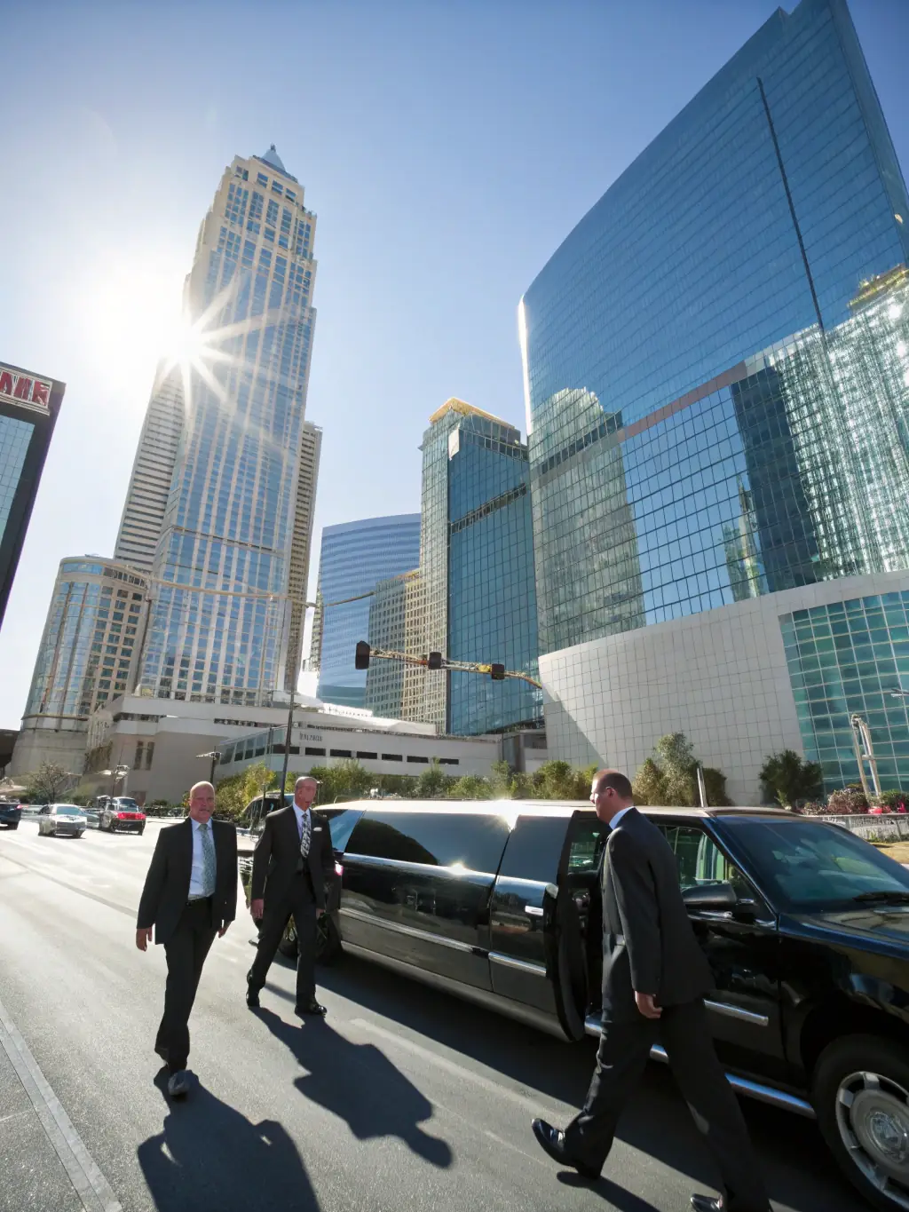 A group of executives exiting a luxury van in front of a convention center, with the Ascend Executive Transportation logo subtly visible on the vehicle. The setting is a bustling city during a corporate event.